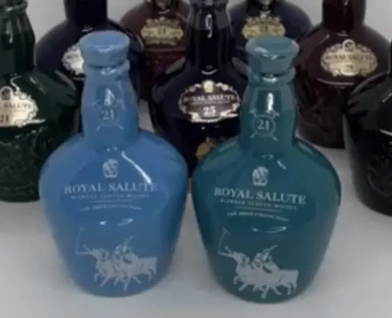Royal Salute Polo Edition (dark turquoise) and Beach Polo Edition (light blue) miniatures side by side